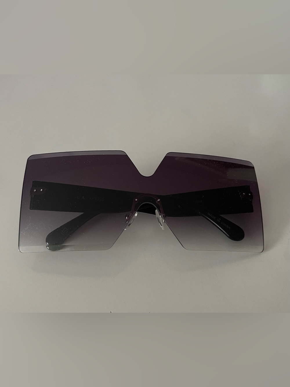 Trendy Chunky Purple Rimless Shield Sunglasses